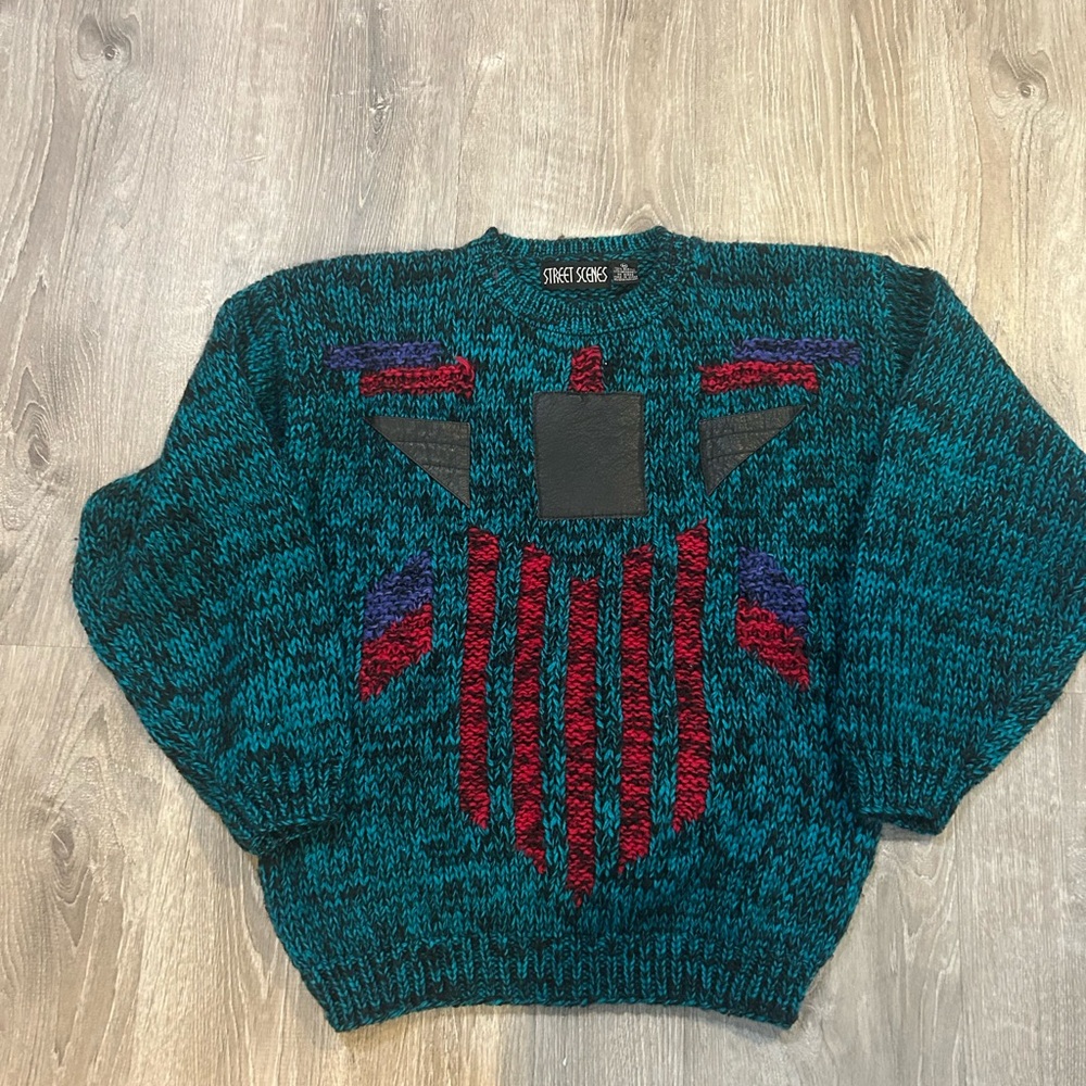Vintage woman’s teal sweater with leather designs size medium from 90s